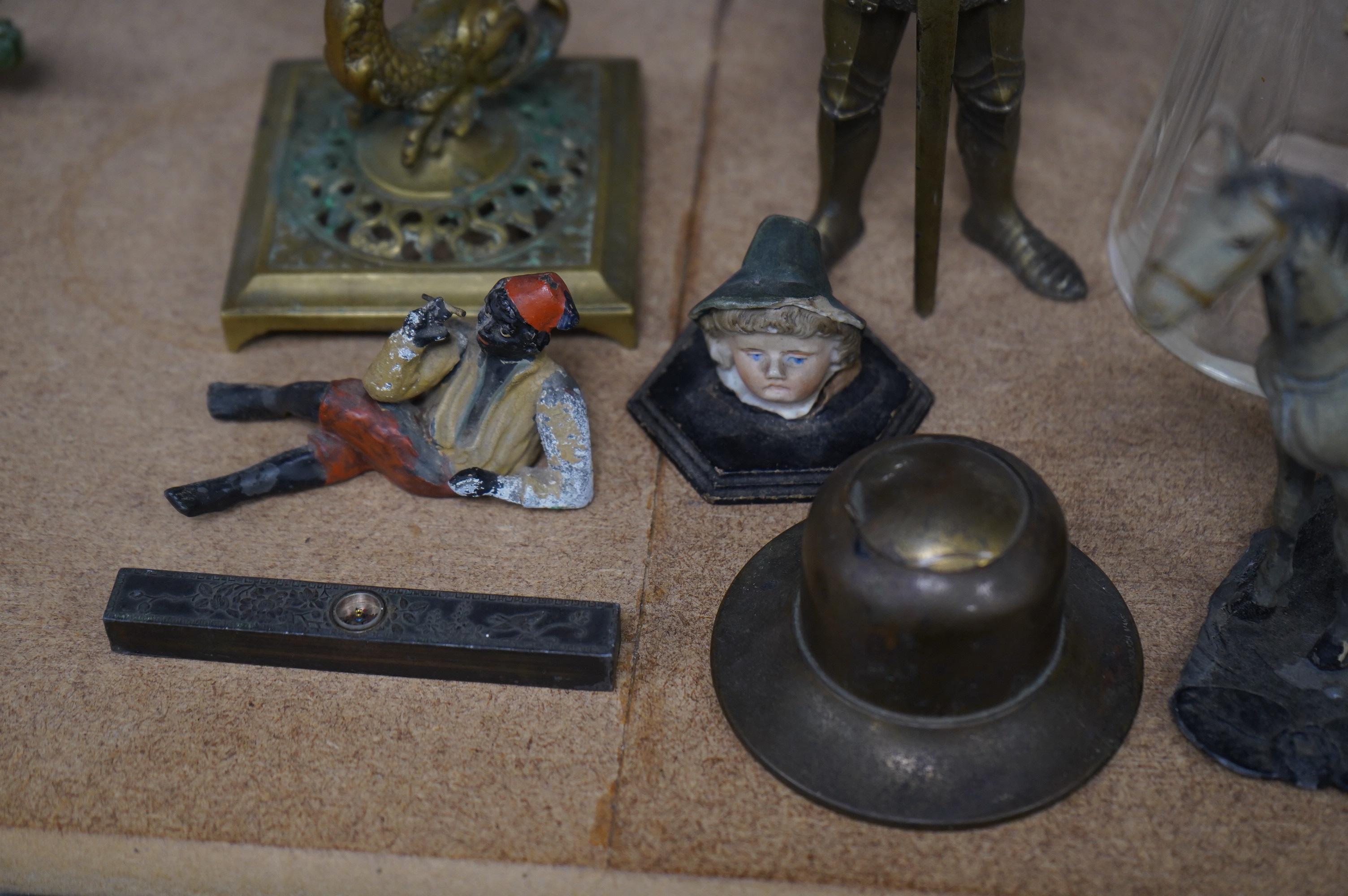 A group of spelter and other metalware items including a table lighter, inkwell etc (8). Condition - varies